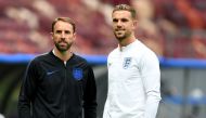 England's midfielder Jordan Henderson (R) and England's coach Gareth Southgate inspect the pitch of the Luzhniki Stadium in Moscow on July 10, 2018, on the eve of their Russia 2018 World Cup semi-final football match against Croatia. AFP / Yuri Cortez