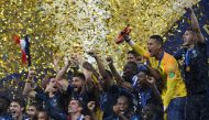 French players celebrate with the trophy at the end of the Russia 2018 World Cup final football match between France and Croatia at the Luzhniki Stadium in Moscow on July 15, 2018.  AFP / Kirill Kudryavtsev  