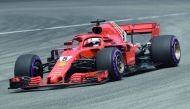 Ferrari's German driver Sebastian Vettel steers his car during the qualifying session on the eve of the German Formula One Grand Prix at the Hockenheimring racing circuit on July 21, 2018 in Hockenheim, southern Germany.  AFP / Christof Stache

