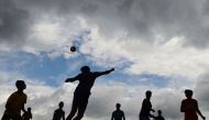 Rohingya refugee children play football at the Kutupalong refugee camp in Ukhia in this picture taken on July 19, 2018.  AFP / Munir Uz Zaman