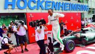 Mercedes' British driver Lewis Hamilton celebrates after winning the German Formula One Grand Prix at the Hockenheim racing circuit on July 22, 2018 in Hockenheim, southern Germany.  AFP / Andrej Isakovic

