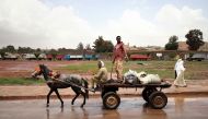 Men ride on a horse cart in the outskirts of Asmara, Eritrea July 21, 2018. Picture taken July 21, 2018. Reuters/Tiksa Negeri