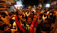 Supporters of Pakistan Tehreek-e-Insaf (PTI) political party celebrate along the road during the general election in Karachi, Pakistan July 25, 2018. REUTERS/Akhtar Soomro