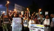 FILE PHOTO: People protest against the rape of an eight-year-old girl in Kathua near Jammu a teenager in Unnao, Uttar Pradesh and an eleven-year-old girl in Surat in Ahmedabad,  April 16, 2018. (Reuters / Amit Dave) 