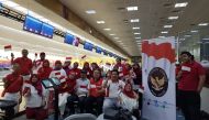 Indonesian Ambassador to Qatar Air Marshal (Ret) Muhammad Basri Sidehabi with community members during the bowling tournament.