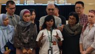 Grace Subathirai Nathan (C), daughter of missing Malaysia Airlines flight MH370 passenger Anne Daisy, speaks during a press conference after being presented with the final investigation report on the missing flight, in Putrajaya, outside Kuala Lumpur, on 