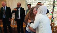 Palestinian activist and campaigner Ahed Tamimi, 17, (2nd R) greets supporters during meeting with the press in the West Bank village of Nabi Saleh on July 30, 2018, following her release from prison. AFP / Abbas Momani