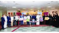 Commercial Bank officials with the latest winners of the bank’s ‘Save & Win’ campaign, at Commercial Bank’s Bin Omran branch.