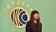 Myu, wife of Japanese journalist Jumpei Yasuda who went missing in Syria in 2015, speaks during a press conference at the Japan National Press Club in Tokyo on August 7, 2018. / AFP / Kazuhiro NOGI 