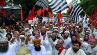 Activists of Pakistan opposition parties shout slogans outside the provincial election commission office against the alleged election rigging in Karachi on August 9, 2018.  AFP / Asif Hassan 