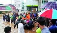 Indian navy and rescue personnel evacuate local residents in an boat at Aluva, in the Indian state of Kerala, on August 16, 2018. AFP