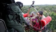 People are airlifted by the Indian Navy soldiers during a rescue operation at a flooded area in the southern state of Kerala, India, August 17, 2018. Reuters/Sivaram V