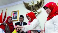 Andi Una Sidehabi, wife of the Ambassador, cutting a traditional rice cake along with Zaenur Rofid, Charge d’Affaires, to mark the country’s 73 years of independence at the Indonesian Chancery on Friday.