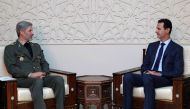 Iranian Defence Minister Amir Hatami (L) meeting with Syrian President Bashar al-Assad (R)in the capital Damascus. AFP / SANA 
