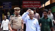 Indian poet and activist Varara Rao (C) gestures as he is escorted by policemen as he is arrested in Hyderabad on August 28, 2018.  AFP