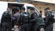 Spanish civil guards arresting an unidentified man in the Spanish enclave of Ceuta.  AFP / Spanish Guardia Civil 
