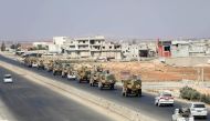 Turkish forces are seen in a convoy on a main highway between Damascus and Aleppo, near the town of Saraqib in the northern Idlib province, on August 29, 2018.   AFP / OMAR HAJ KADOUR
