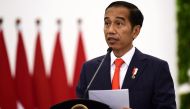 Indonesia's President Joko Widodo speaks during a press conference at the presidential palace in Bogor, West Java on August 31, 2018. / AFP / SONNY TUMBELAKA 