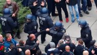 Participants of the demonstration of Germany's anti-immigration party Alternative for Germany (AfD) attack police in Chemnitz, Germany, September 1, 2018. Picture taken September 1, 2018. REUTERS/Hannibal Hanschke