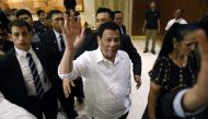 The president of the Philippines Rodrigo Roa Duterte (C) waves upon his arrival in Jerusalem at the start of an official visit to Israel, on September 2, 2018. / AFP / MENAHEM KAHANA 