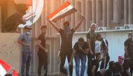 Iraqis protest against the government and the lack of basic services outside the regional government headquarters in the southern city of Basra on September 5, 2018.   AFP / Haidar MOHAMMED ALI