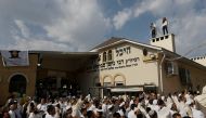Ultra-Orthodox Jewish pilgrims pray at the tomb of Rabbi Nachman of Breslov during the celebration of Rosh Hashana holiday, the Jewish New Year, in Uman, Ukraine, September 21, 2017. (Reuters)
