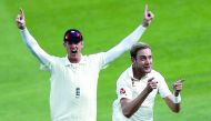 England's Stuart Broad (R) celebrates after taking the wicket of India's captain Virat Kohli on the fourth day of the fifth Test cricket match between England and India at The Oval in London on September 10, 2018. AFP / Adrian Dennis