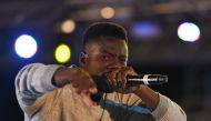 Ivorian rapper Bop de Narr performs on stage, on August 24, 2018, during Festi Primud 2018 urban culture festival in Abidjan. AFP / Sia KAMBOU
