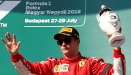 :FILE PHOTO: Ferrari’s Kimi Raikkonen. REUTERS/Bernadett Szabo
