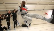 This handout photo released by Mumm/Novespace on September 13, 2018 shows Jamaican retired sprinter Usain Bolt (C) gesturing in zero-gravity conditions in an aircraft on September 12, 2018 above Reims.  AFP  / Mumm/Novespace/Laurent Theillet