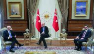 Turkish President Recep Tayyip Erdogan (C) meets BBVA's executive chairman Francisco Gonzalez Rodriguez (L) in Ankara, Turkey on September 12, 2018.  (Kayhan Özer/Anadolu Agency)