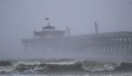 Waves created by Hurricane Florence are seen along Cherry Grove Fishing Pier on September 14, 2018 in North Myrtle Beach, United States. Joe Raedle/Getty Images/AFP  