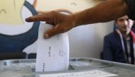 A man casts his ballot for Syria's first local elections since 2011, on September 16, 2018 in the southern Eastern Ghouta, on the eastern outskirts of the capital Damascus.   AFP / LOUAI BESHARA