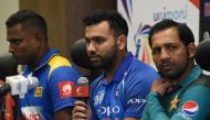 Indian cricket team captain Rohit Sharma (C) speaks during an Asia Cup press conference as Sri Lankan cricket team captain Angelo Mathews (L) and Pakistan cricket captain Sarfraz Ahmed (R) look on at the Dubai International Cricket Stadium in Dubai on Sep
