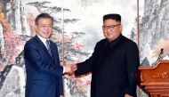 South Korean President Moon Jae-in shakes hands with North Korean leader Kim Jong Un during a joint news conference in Pyongyang, North Korea, September 19, 2018. Pyeongyang Press Corps/Pool via REUTERS