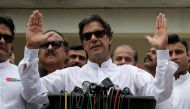 FILE PHOTO: Cricket star-turned-politician Imran Khan, chairman of Pakistan Tehreek-e-Insaf (PTI), speaks to members of media after casting his vote at a polling station during the general election in Islamabad, Pakistan, July 25, 2018. REUTERS/Athit Pera