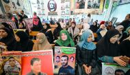 People gather to show their support to the Palestinian prisoners in Israeli jails, in front of International Committee of the Red Cross office in Gaza City, yesterday.