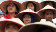 Indonesian farmers attend a large protest over land reform and other agricultural issues in central Jakarta, June 8, 2004. (Reuters/Darren Whiteside) 