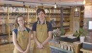 Masefield and Robin Masefield from Natural Weigh pose at their Crickhowell zero-waste shop, August 2018. (Wales Co-operative Centre)

