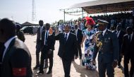 Cameroon's President Paul Biya (C), accompanied by his wife Chantal Biya, greets the military forces upon arrival at Maroua airport during his electoral visit in the Far North Region of Cameroon, on September 29, 2018. AFP / ALEXIS HUGUET