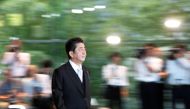 Japan's Prime Minister Shinzo Abe wearing formal costume leaves his official residence to attend an attestation ceremony at the Imperial Palace, in Tokyo, Japan October 2, 2018. REUTERS/Issei Kato