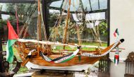 This picture taken on October 2, 2018 shows a modelled boat with palestinian flags on it displayed in room of the Zahra Centre, the headquarters of a a Shiite Islamic association in Grande Synthe, northern France, after it was raided by 200 police men as