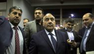 Independent Shia candidate Adil Abdul-Mahdi (C) is seen after newly elected president Barham Salih (not seen) has given the task to form the government to Adil Abdul-Mahdi at the the Iraqi Parliament building in Baghdad, Iraq on October 2, 2018. Murtadha