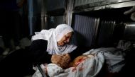 A relative reacts at the body of a Palestinian who was killed during a protest at the Israel-Gaza border fence, in Gaza City October 5, 2018. Reuters/Mohammed Salem