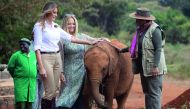 US First Lady Melania Trump (L) and First Lady of Kenya Margaret Kenyatta (R) pet a baby elephant at The David Sheldrick Elephant Orphanage in Nairobi on October 5, 2018, as she pays a one day visit to the country during her solo tour of Africa promoting 