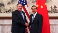 US Secretary of State Mike Pompeo (L) shakes hands with China's Foreign Minister Wang Yi (R) before they proceed to their meeting at the Diaoyutai State Guesthouse in Beijing on October 8, 2018. / AFP / POOL / Andy Wong 