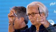 International Monetary Fund chief Christine Lagarde (R) gestures during her press conference at the International Monetary Fund (IMF) and World Bank annual meetings in Nusa Dua on Indonesia’s resort island of Bali on October 11, 2018.  / AFP / Goh Chai Hi