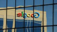 The Google logo is shown reflected on an adjacent office building in Irvine, California, August 7, 2017 (Reuters/Mike Blake) 
