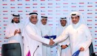 Ooredoo COO Yousuf Abdulla Al Kubaisi (left) and Doha Bank Managing Director Sheikh Abdulrahman bin Mohammad bin Jabor AI Thani shake hands after the signing agreement.