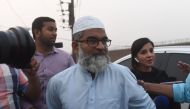 Ameen Ansari (C), the father of six-year-old Zainab Fatima Ameen who was found raped and murdered, leaves the Kot Lakhpat Jail in Lahore on October 17, 2018 following the execution of Imran Ali, who was convicted of the crime. AFP / ARIF ALI
